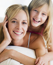 woman and girl smiling